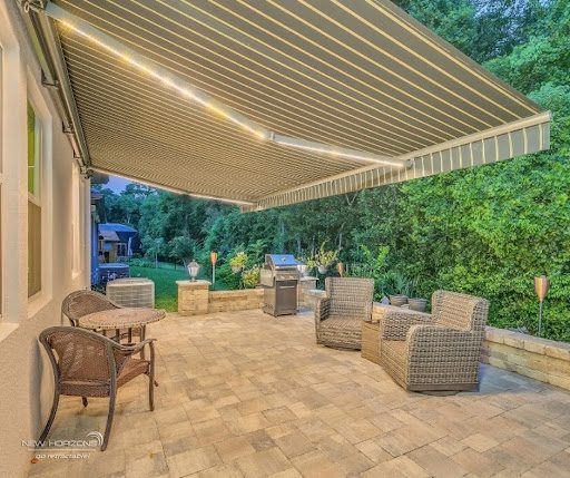 Retractable awning with built-in LED lighting at night