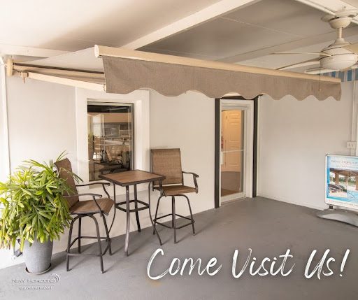 Completed retractable awning installation by New Horizons in Central Florida